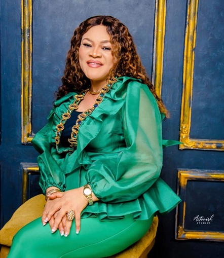 Dr. Henrietta professional portrait in yellow outfit